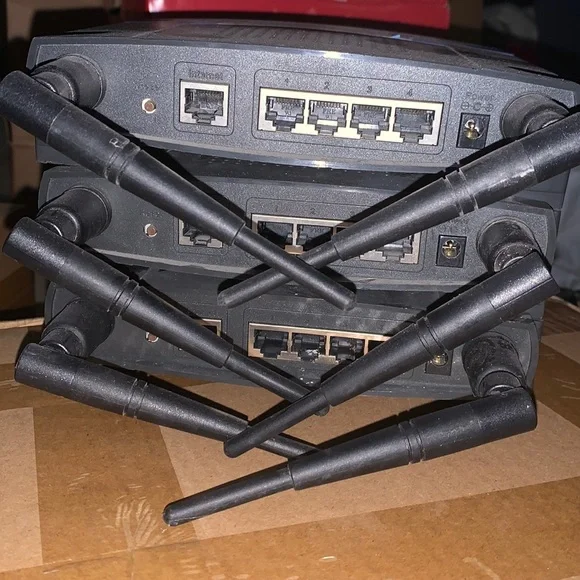 Three Linksys Wireless-G WRT 54g Version 3